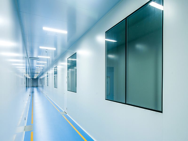 Laboratory wall with sealed flush clean room window